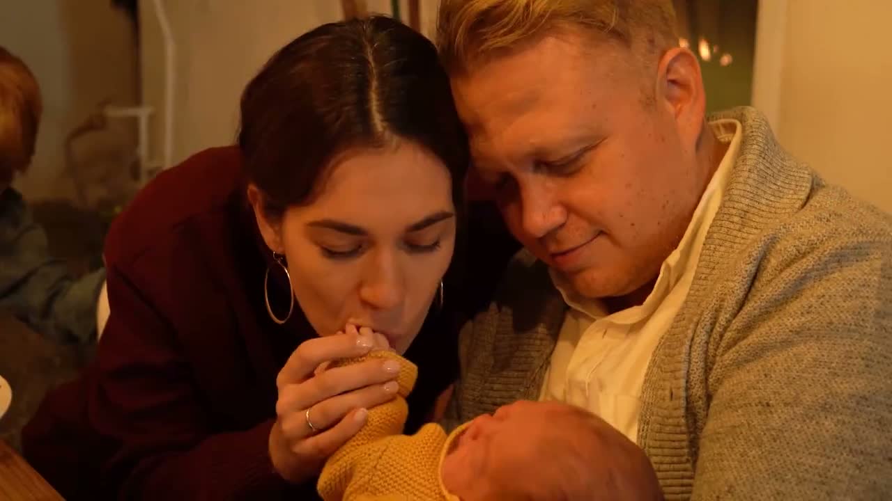 Parents holding their newborn baby